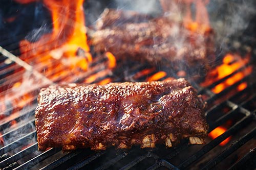 Ribs being cooked on a open flame